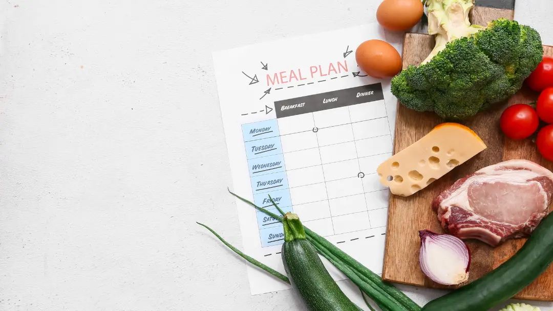 Overhead view of a organized weekly meal spread